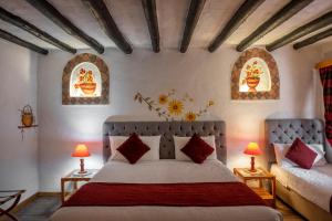Кровать или кровати в номере Hotel Spa Casa de Adobe Villa de Leyva