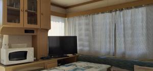 TV a/nebo společenská místnost v ubytování Mobilhome emplacement 2
