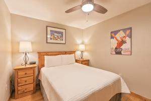 a bedroom with a bed and a ceiling fan at Riverbend Centennial Run Condo: Ski In/Out in Breckenridge