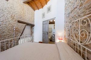 Postel nebo postele na pokoji v ubytování Agriturismo Nonnamelia