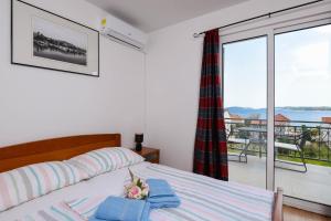 Postel nebo postele na pokoji v ubytování Lulak Studio Apartments