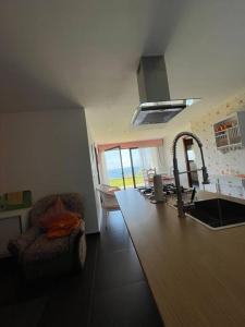 a kitchen with a sink and a counter top at Casa Chan do Eiro in Nigrán