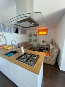 a kitchen with a sink and a stove in a room at Casa Chan do Eiro in Nigrán