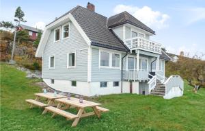 a house with a picnic table in front of it at Beautiful Home In Filtvet With Kitchen in Filtvet