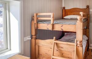 a bedroom with two bunk beds in a room at Awesome Home In len With Wifi And 2 Bedrooms in Ålen