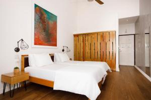 Postel nebo postele na pokoji v ubytování Divers Paradise Boutique Hotel