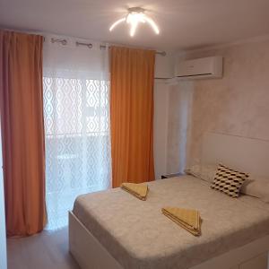 a bedroom with a large bed and a window at Sweet dreams in Alicante
