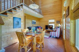 a dining room with a table and chairs at Lakefront Vacation Rental with Patio and Grill! in Columbia