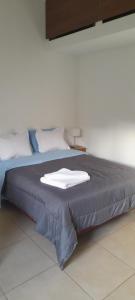 Postel nebo postele na pokoji v ubytování Castor Fueguino: departamento cálido, céntrico y equipado - Wi Fi