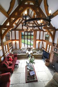 a large living room with couches and a chandelier at Fletchers Hall in Freckleton