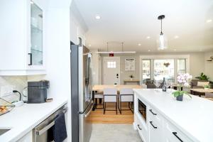 a kitchen and dining room with white countertops at The Newark House in Niagara on the Lake