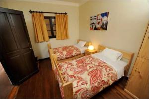 Ένα ή περισσότερα κρεβάτια σε δωμάτιο στο Bear Packer Hostel