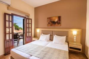 Ένα ή περισσότερα κρεβάτια σε δωμάτιο στο Aphrodite Luxury Studios & Apartments  +81 φωτογραφίες