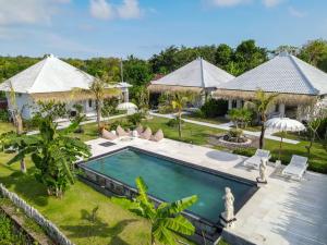 an aerial view of a villa with a swimming pool at Sukacita Hill in Uluwatu