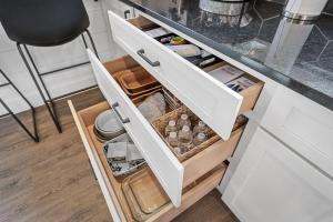a kitchen with an open drawer with food items at Whispering Pines - Lakeside in High Hill