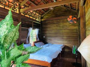 Postel nebo postele na pokoji v ubytování SuoiRao Forest