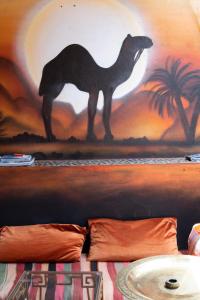 a painting of a dinosaur on top of a table at Booking and hosting medina in Casablanca