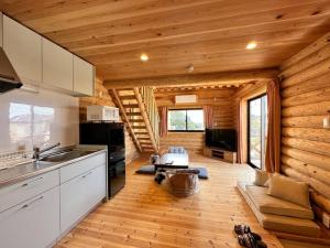 a kitchen and living room in a log cabin at SHIRAHAMA condominium K-32 in Kanayama