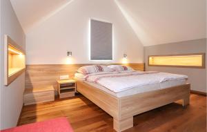 a bedroom with a large bed and a window at Kellerstoeckl In Eltendorf in Eltendorf