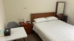מיטה או מיטות בחדר ב-Sharkat Homestay