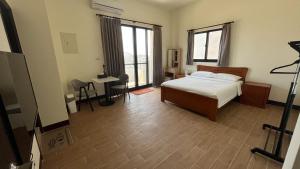 מיטה או מיטות בחדר ב-Sharkat Homestay