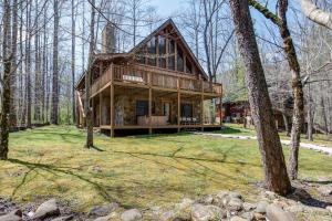 a large wooden house in the woods at Amazing River Retreat in Sevierville