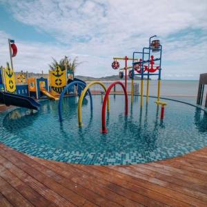 a water park with a water slide in the water at Imperium Resident Kuantan Eleven-7 in Kuantan
