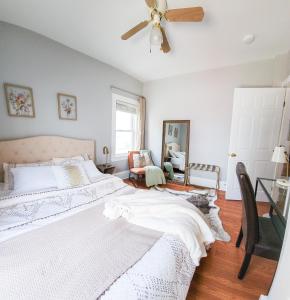 a bedroom with a bed and a ceiling fan at Luxe 3BR Apartment at MIT Harvard with FREE parking in Cambridge