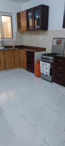 an empty kitchen with a stove and a counter at H20 in Mombasa