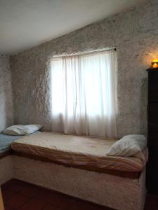 Postel nebo postele na pokoji v ubytování La escondida