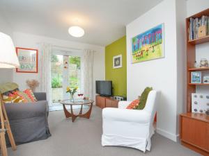 a living room with a couch and a table at Malborough Park in Malborough