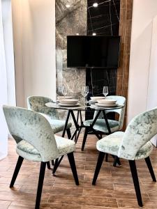 a dining room with a table and chairs at Central Family Boutique Apartments 3 in Lviv