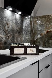 a cake sitting on top of a counter in a bathroom at Central Family Boutique Apartments 3 in Lviv