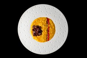a white plate with a dessert on it at Resort Miramonti in Forte dei Marmi