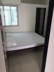 Postel nebo postele na pokoji v ubytování PATEL HOME STAY