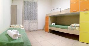 a room with two bunk beds with towels on them at Heraclea Home in Roseto Capo Spulico