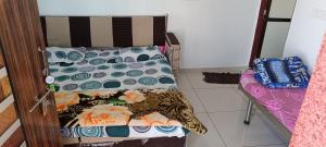 Postel nebo postele na pokoji v ubytování PATEL HOME STAY