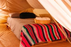 Postel nebo postele na pokoji v ubytování Nomada Glamping & Aguas Termales - San Miguel de Allende X NANTLI LIVING
