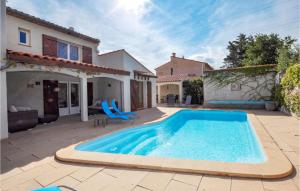 a swimming pool in the backyard of a house at Beautiful Home In Saint-André in Saint-André +20 photos