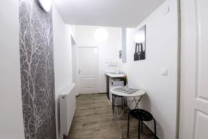 Televízia a/alebo spoločenská miestnosť v ubytovaní Rio's Stylish Central Flats