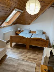 Postel nebo postele na pokoji v ubytování Global Apartmanház