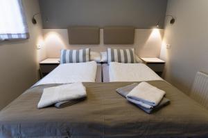 Katil atau katil-katil dalam bilik di Apartment Kanalec