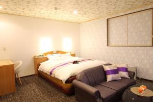 Hotel DOLPHIA-Adult Only客房内的一张或多张床位