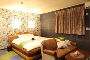Hotel DOLPHIA-Adult Only客房内的一张或多张床位