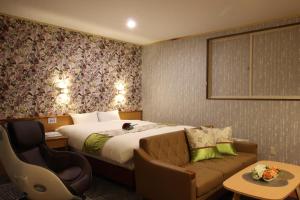 Hotel DOLPHIA-Adult Only客房内的一张或多张床位
