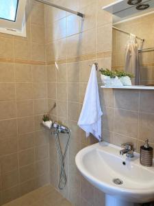 a bathroom with a sink and a mirror at La casa de campo in Heraklio