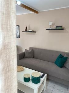 a living room with a couch and a table at La casa de campo in Heraklio