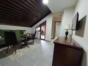 a living room with a couch and a table at Loven dom Berovo in Berovo