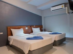 Postel nebo postele na pokoji v ubytování Leisure Hostel