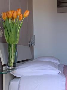 Postel nebo postele na pokoji v ubytování B&B Quattro Lune